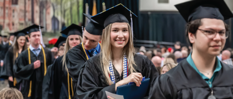 Student smiling at graduation.