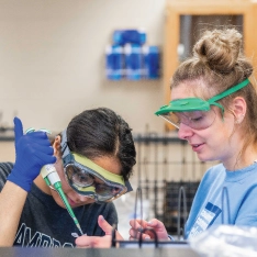 Two students working in biochemistry lab.