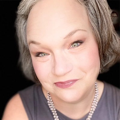 Elizabeth Hulsbrink smiles into the camera.