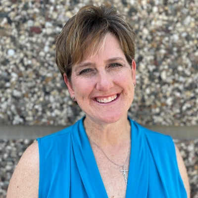 Jen Walker smiles into the camera.