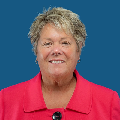 Tina Kohn smiles at the camera.